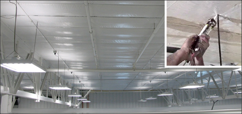 worker caulking around ceiling obstructions
